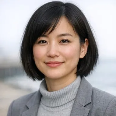 Woman in her early 30s with dark bob hair and a calm expression